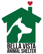 A green house with a black silhouette of a dog.